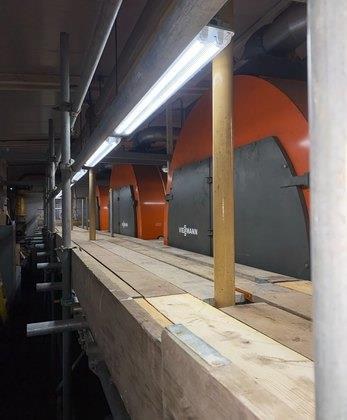 Ladder access and gated platform inside a plant room